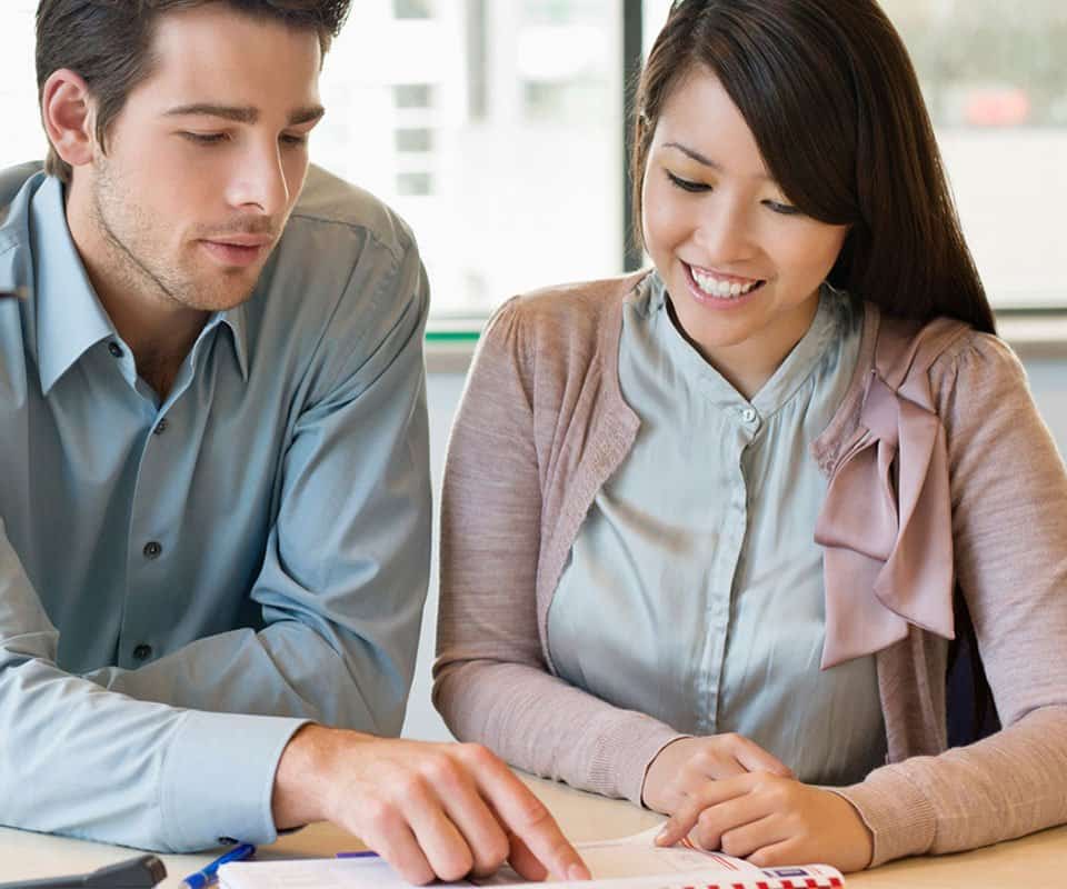 Brokers looking over Hometown Health's broker forms.